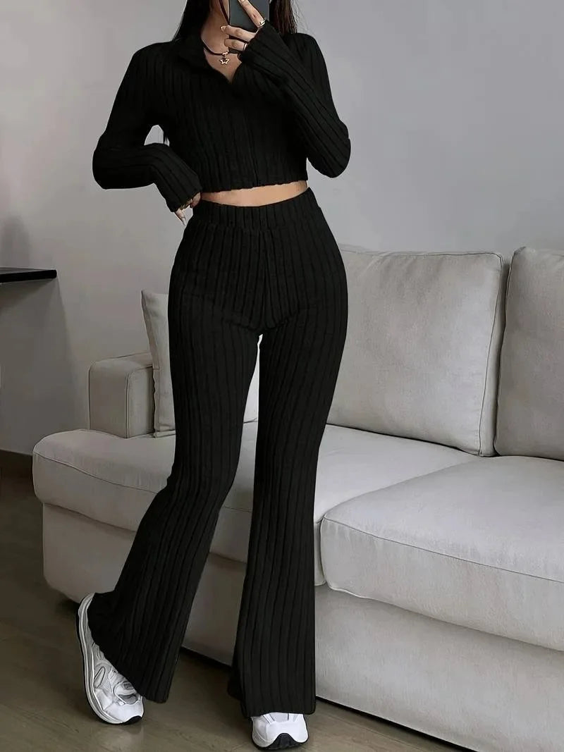 Black striped 2-piece women's casual set with ribbed texture, long-sleeve crop top, and flared pants. Perfect for everyday fashion.