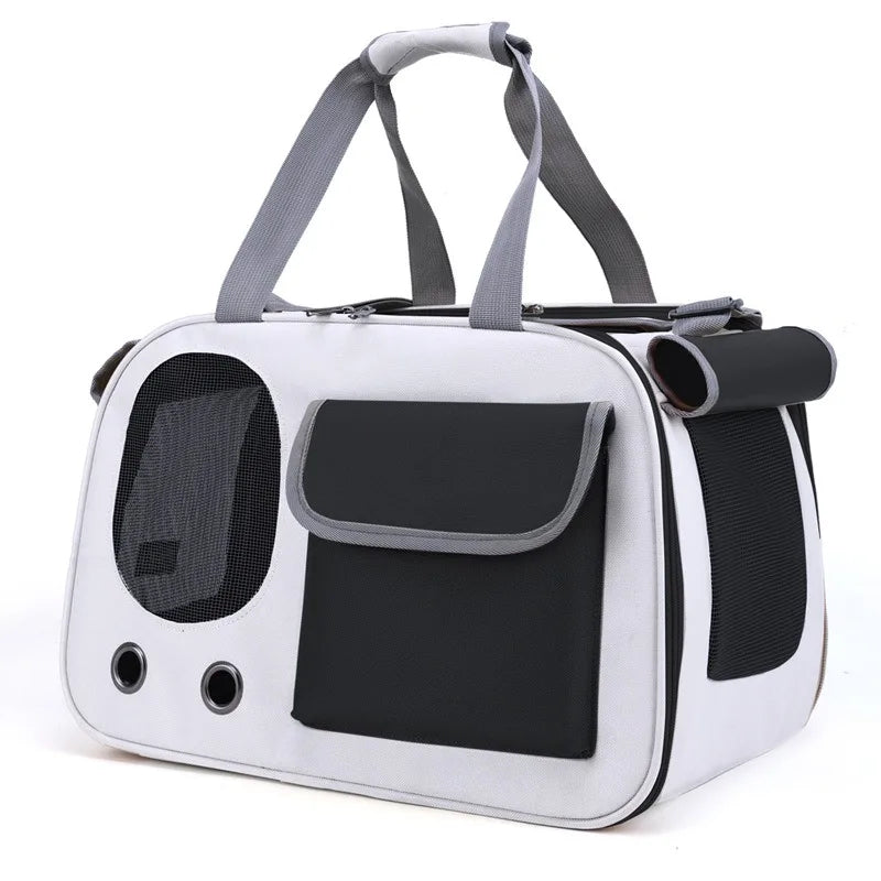 Black and white travel pet carrier bag with mesh windows and front pocket, perfect for easy and stylish pet travel with cats and dogs.