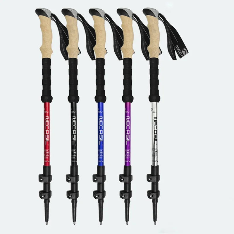 Set of five aluminum quick lock trekking poles in multiple colors, featuring ergonomic grips for outdoor hiking enthusiasts.