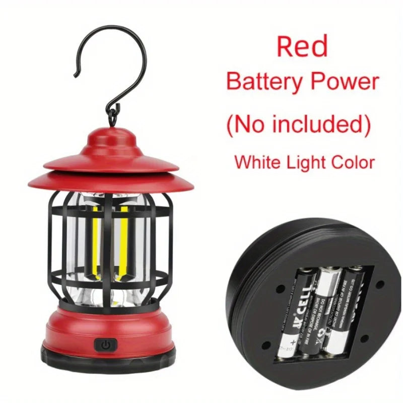 Red vintage-style LED camping lantern, battery-powered with white light, ideal for portable outdoor recreation lighting.