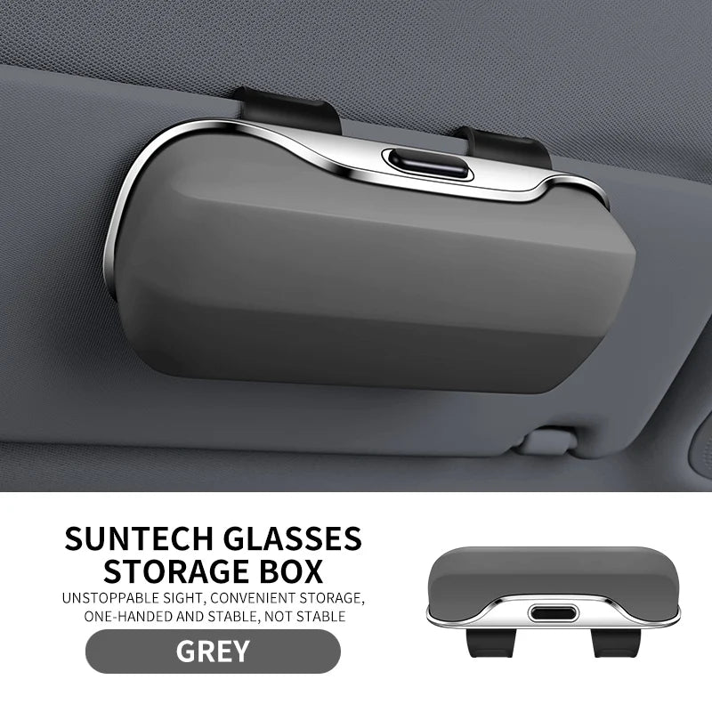 Grey car sun visor glasses holder with ABS shell and plush lining. Provides stable, scratch-free storage for eyewear in vehicles.