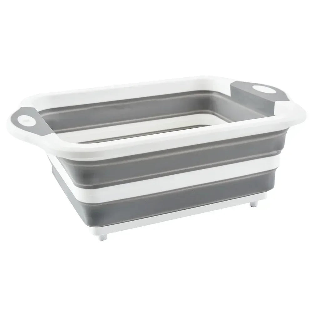 White and gray version of Collapsible Cutting Board Sink in expanded form with drain plug, suitable for outdoor recreation and compact kitchens.