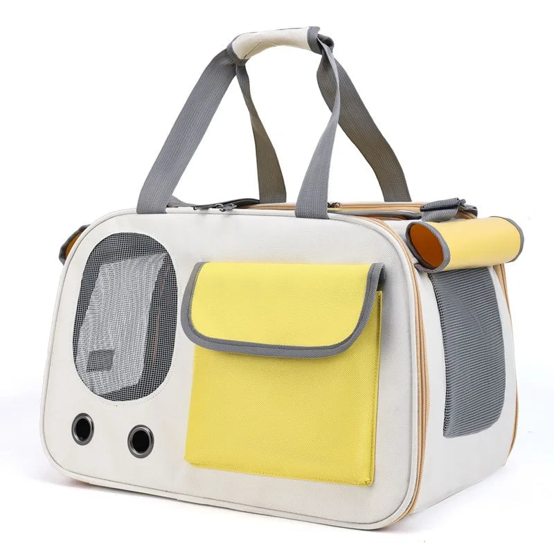 Yellow travel pet carrier bag with breathable mesh sides and front pocket, designed for convenient and portable travel with cats and dogs.