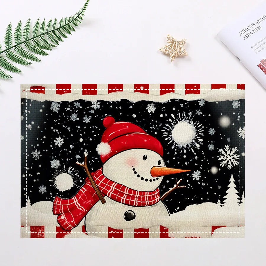 Christmas snowman placemat with red hat and scarf on a snowy black background, ideal for festive table settings.