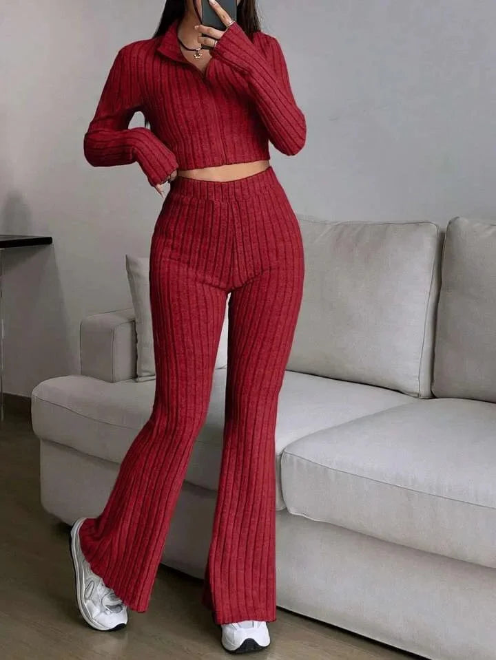 Red striped 2-piece women's casual set with a rib-knit crop top and flared pants. A bold choice for sporty and lounge fashion.