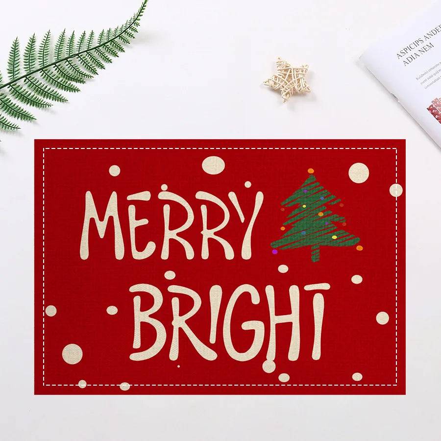 Red placemat with 'Merry Bright' text and green Christmas tree, designed for holiday dining insulation and decor.