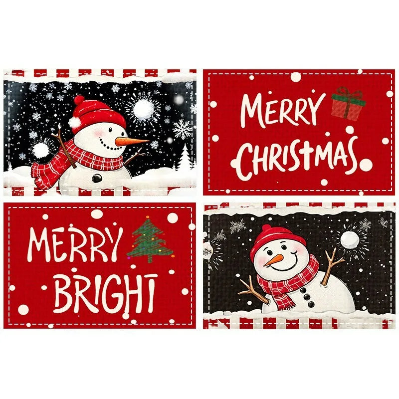 Set of four holiday table mats with snowman illustrations and Christmas greetings, perfect for winter dining decor.
