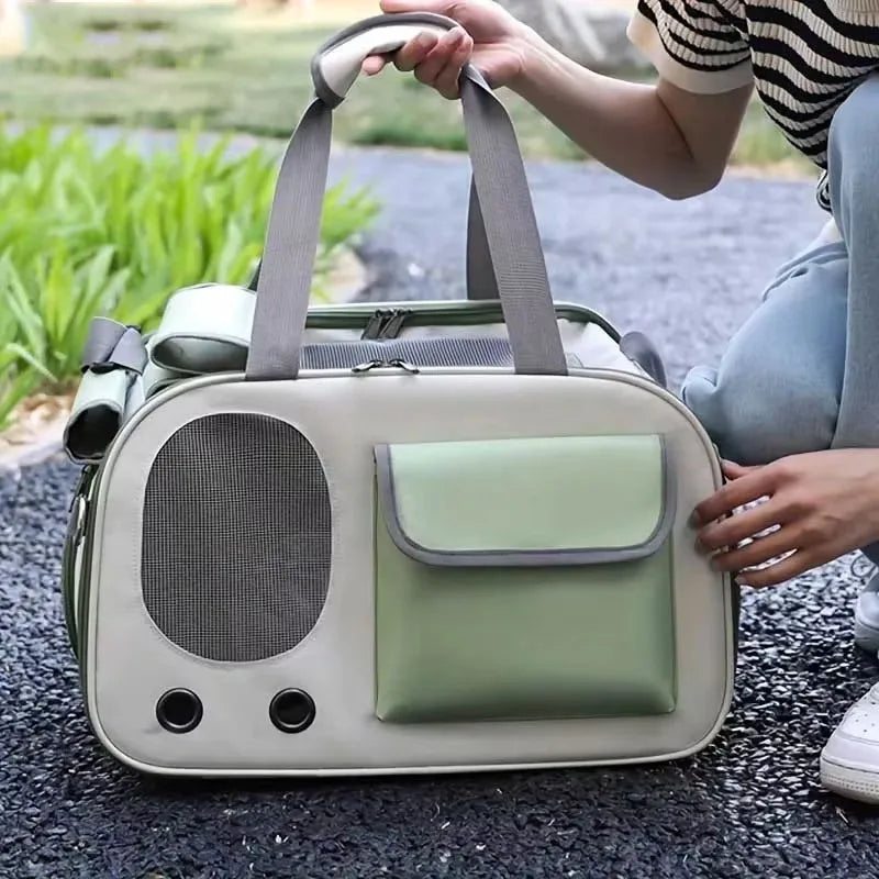 Close-up of green travel pet carrier bag with mesh ventilation and front pocket, suitable for transporting cats and dogs comfortably.