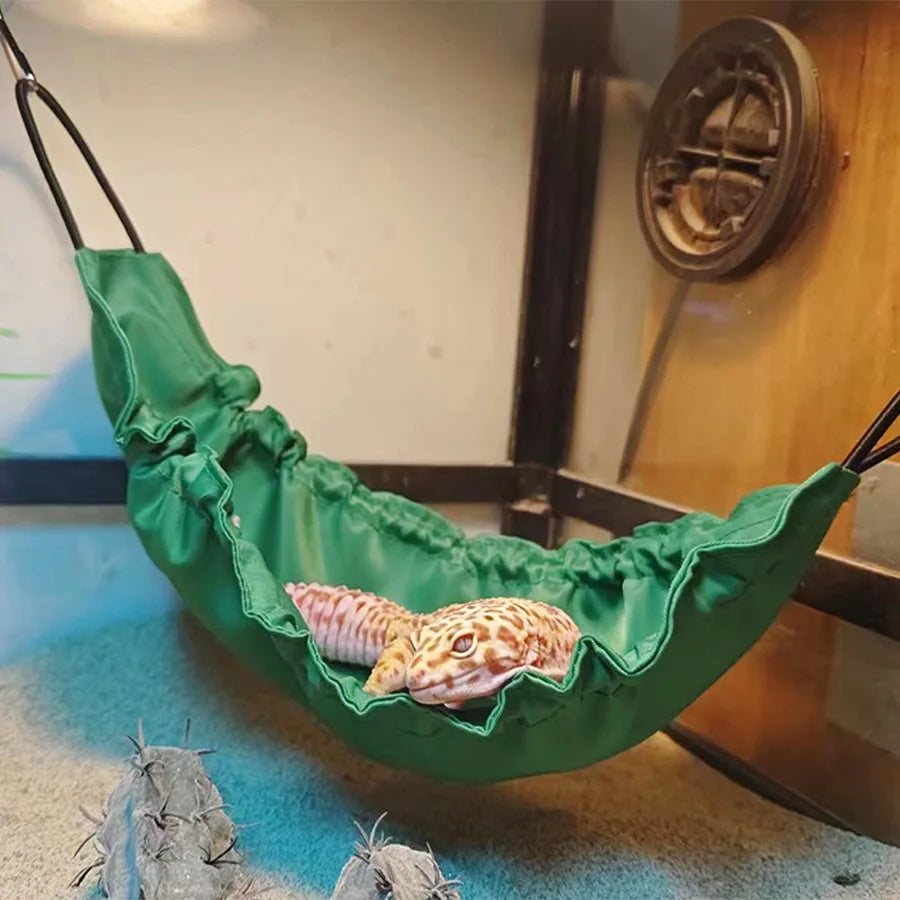 Green Lizard Climbing Hammock with a leopard gecko resting, designed as a cozy hideaway and swing for reptile habitats.