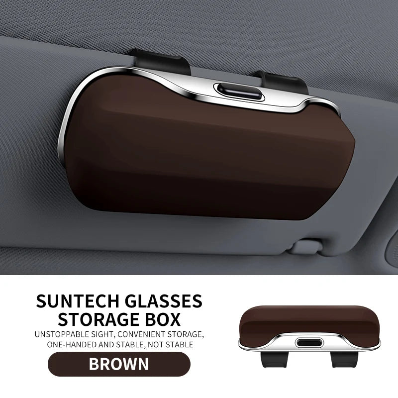 Brown ABS car glasses holder mounted on sun visor. Offers one-handed access and lens protection for eyewear in automotive use.