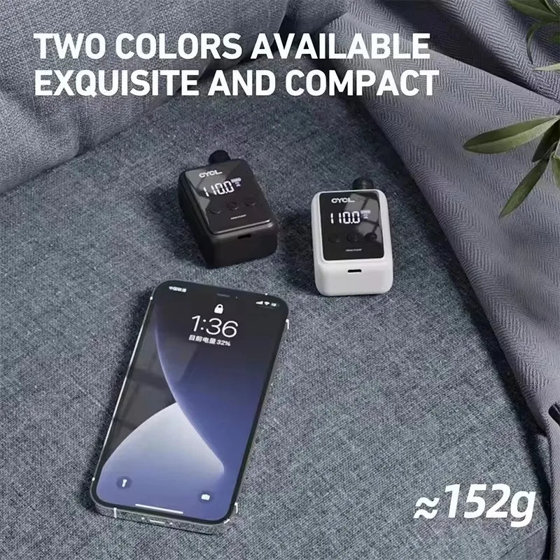 Two color options of the Portable Electric Bike Pump 150Psi next to a smartphone. Compact mini inflator weighs approximately 152g.