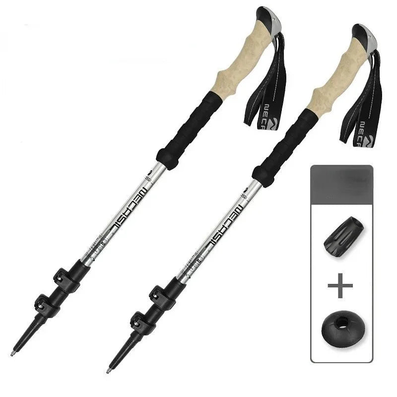 Silver telescopic hiking poles with quick lock and anti-shock features, made for stability on various terrains.