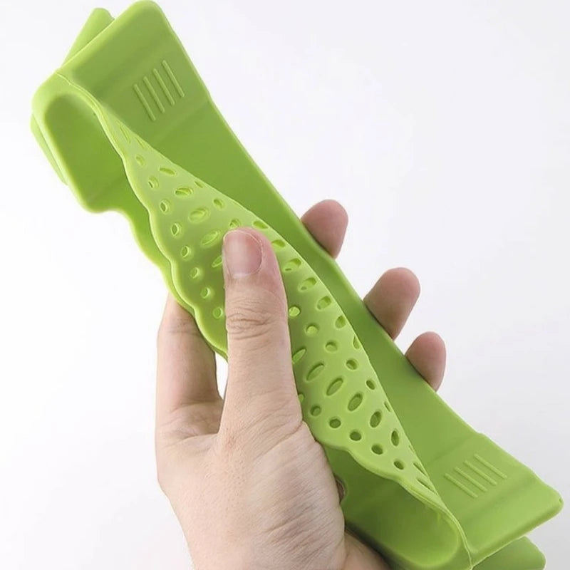 Folded Silicone Strainer - Noodle Vegetable | Spill-Free Design held in hand, demonstrating compact, space-saving kitchen storage.