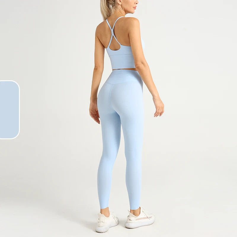 Light blue 2-piece yoga outfit for women featuring a fitted sports bra and leggings, perfect for active lifestyles.