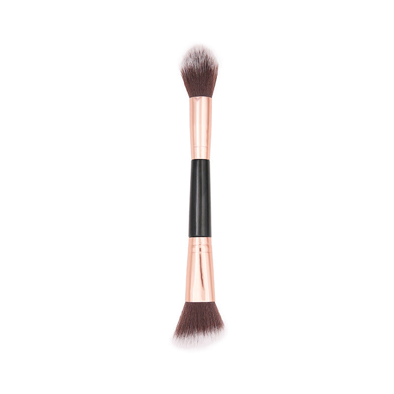 Dual-ended contour brush with rose gold accents, designed for precise application of the Eye & Cheek Palette’s blush, highlight, and contour shades.